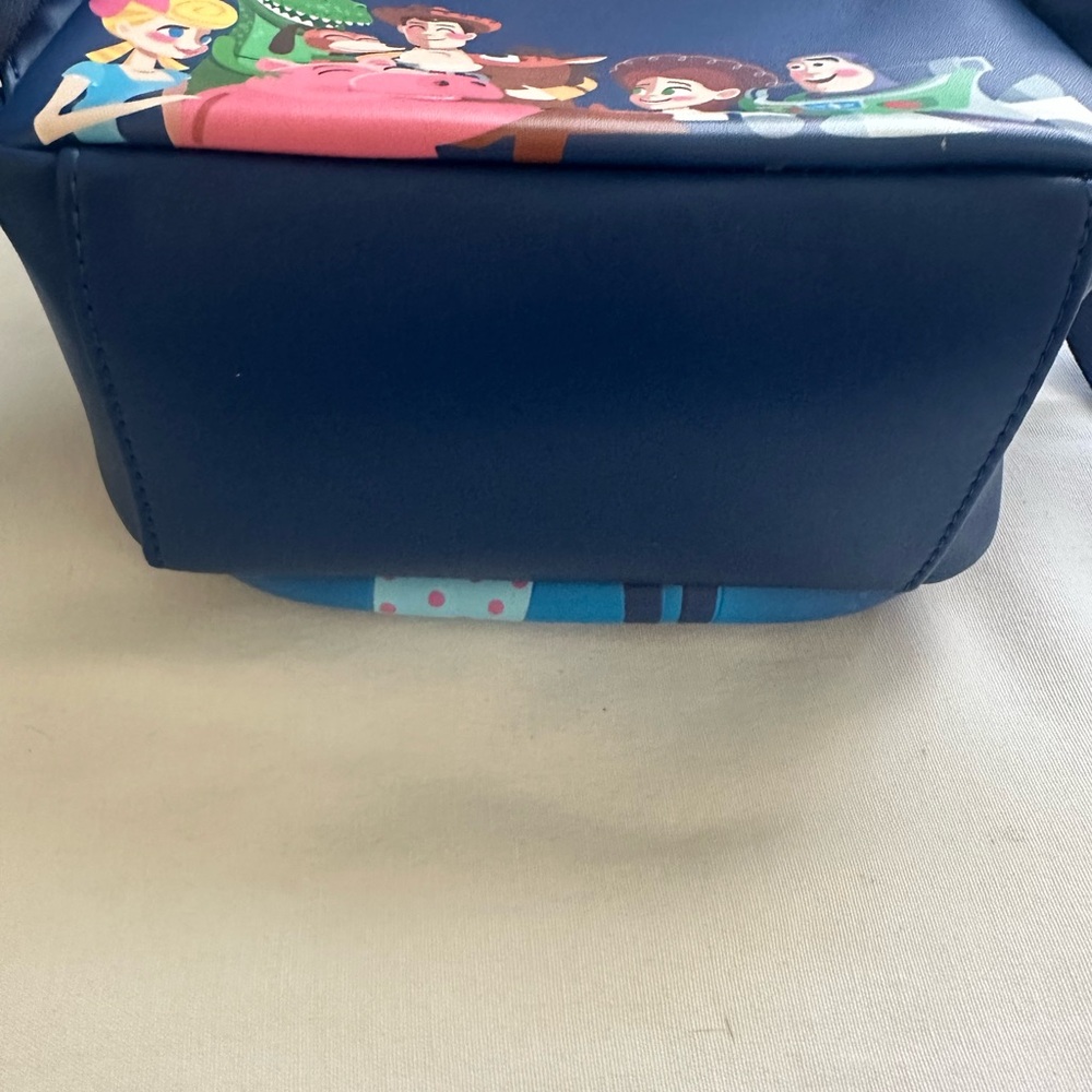 LOUNGEFLY PIXAR MOMEMT TOY STORY WOODY, BO PEEP, & TOYS BACKPACK - Picture 7 of 9